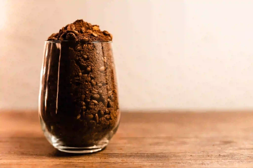 Coffee Grounds in a transparent glass.