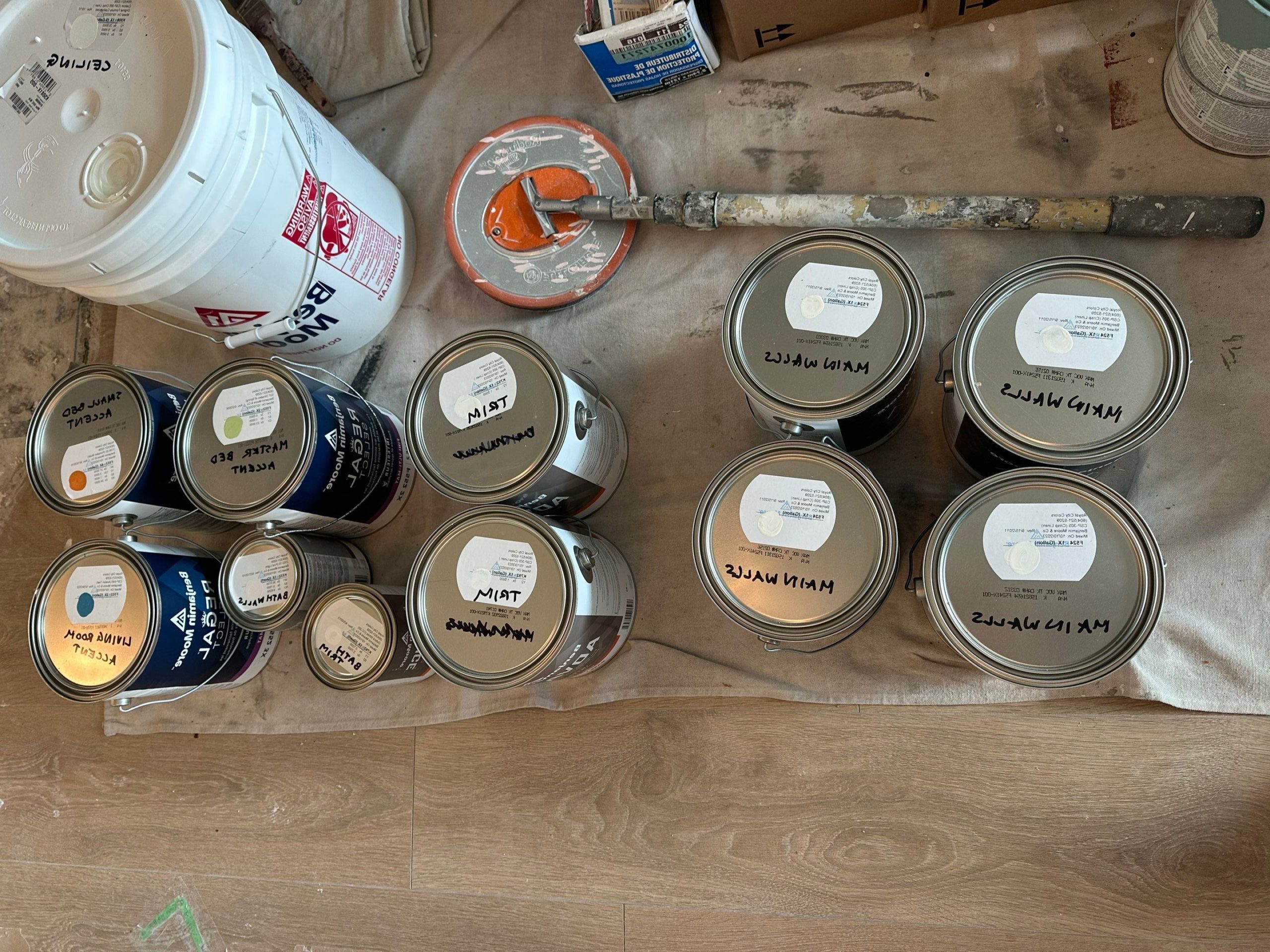 Cans of high quality paint from Benjamin Moore.