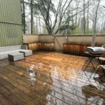 Covered outdoor deck viewed from living room after interior house painting in Vancouver by Renaissance Painting.