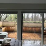 Covered outdoor deck viewed from living room after interior house painting in Vancouver by Renaissance Painting.