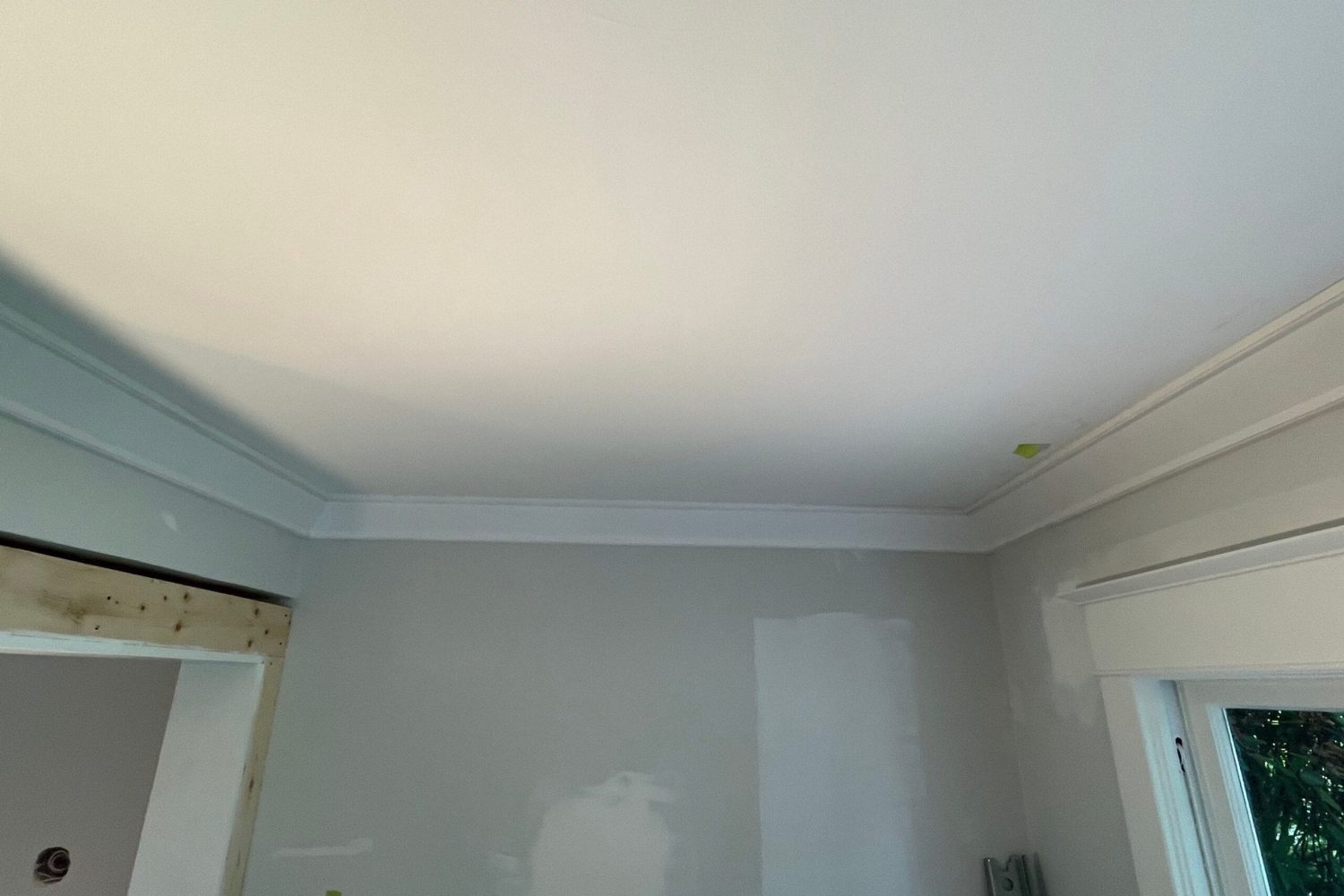 Room with crown molding on ceiling and window, premium installation service