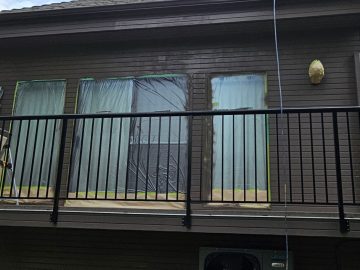 Vancouver exterior painting prep showing masked windows and clean siding work in a professional, detail-focused finish.