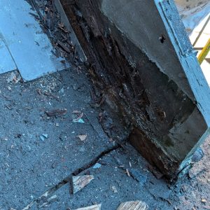 A wooden post of outdoor railing showing quality carpentry services in exterior details