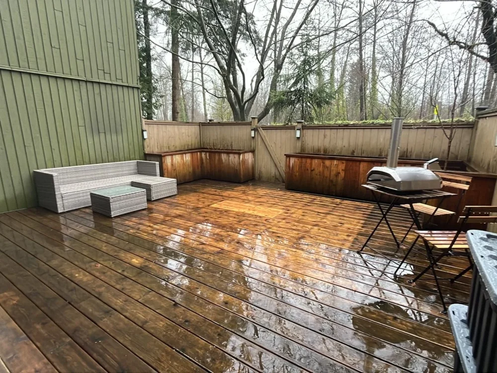 Covered outdoor deck viewed from living room after interior house painting in Vancouver by Renaissance Painting.