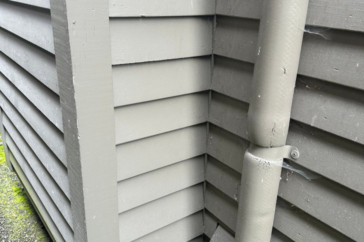 A downspout on a house siding